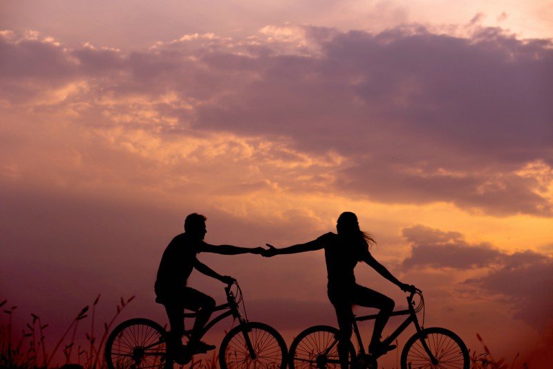 Empathy hand in hand on bikes