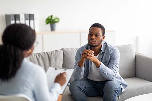 Man listening to therapist about drug detox