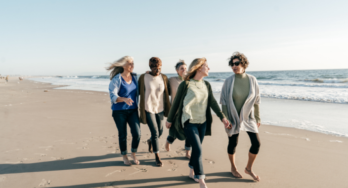 women walking on beach