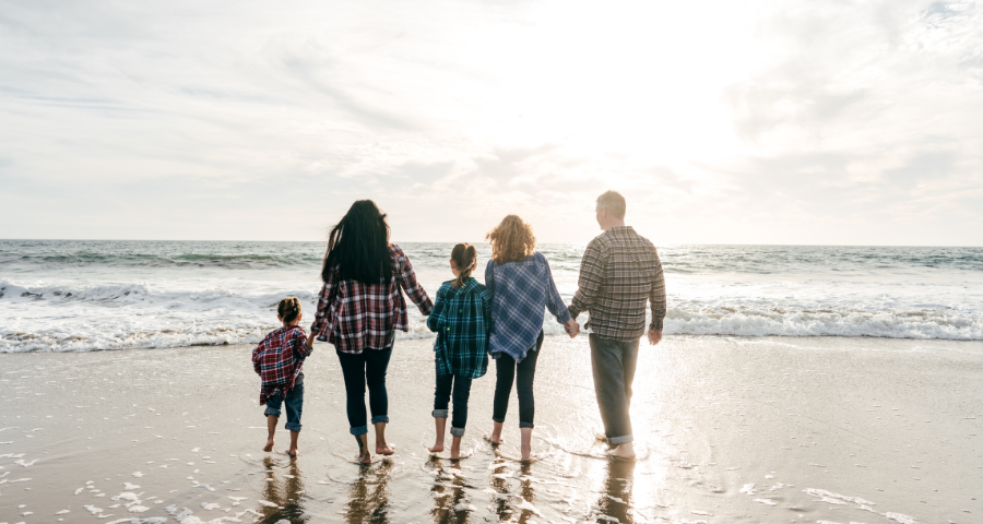 choose alcohol family walking on beach