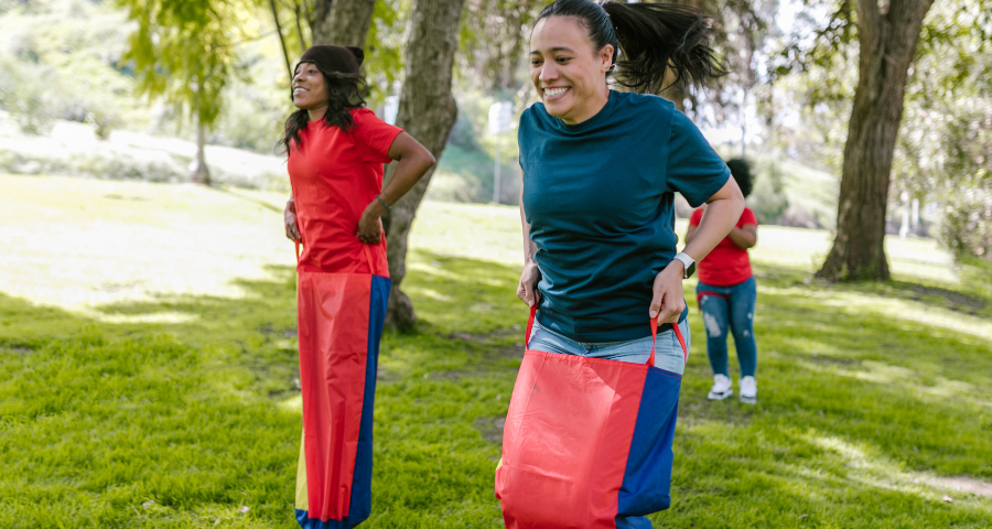 Women in sack race showing non-drinkers are not boring