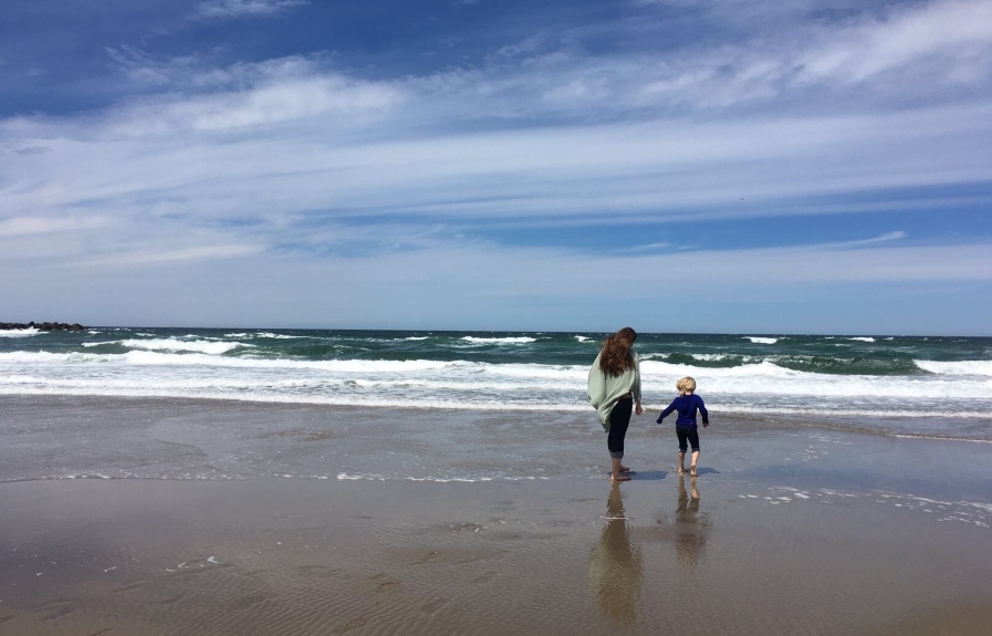 the vital role of family woman and child on a beach