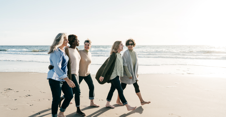 women and alcohol women walking on beach
