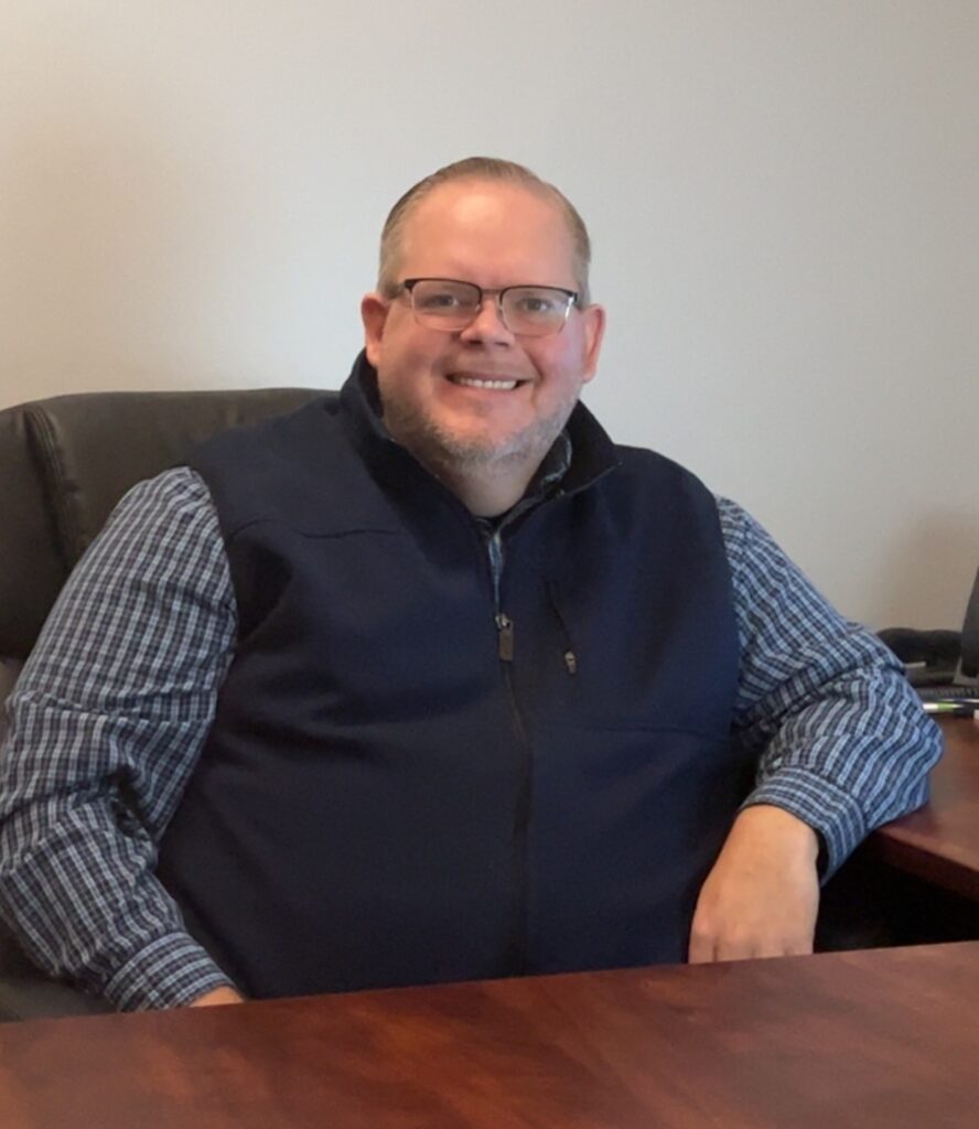 helping profession Wade Stitt clinical director at his desk